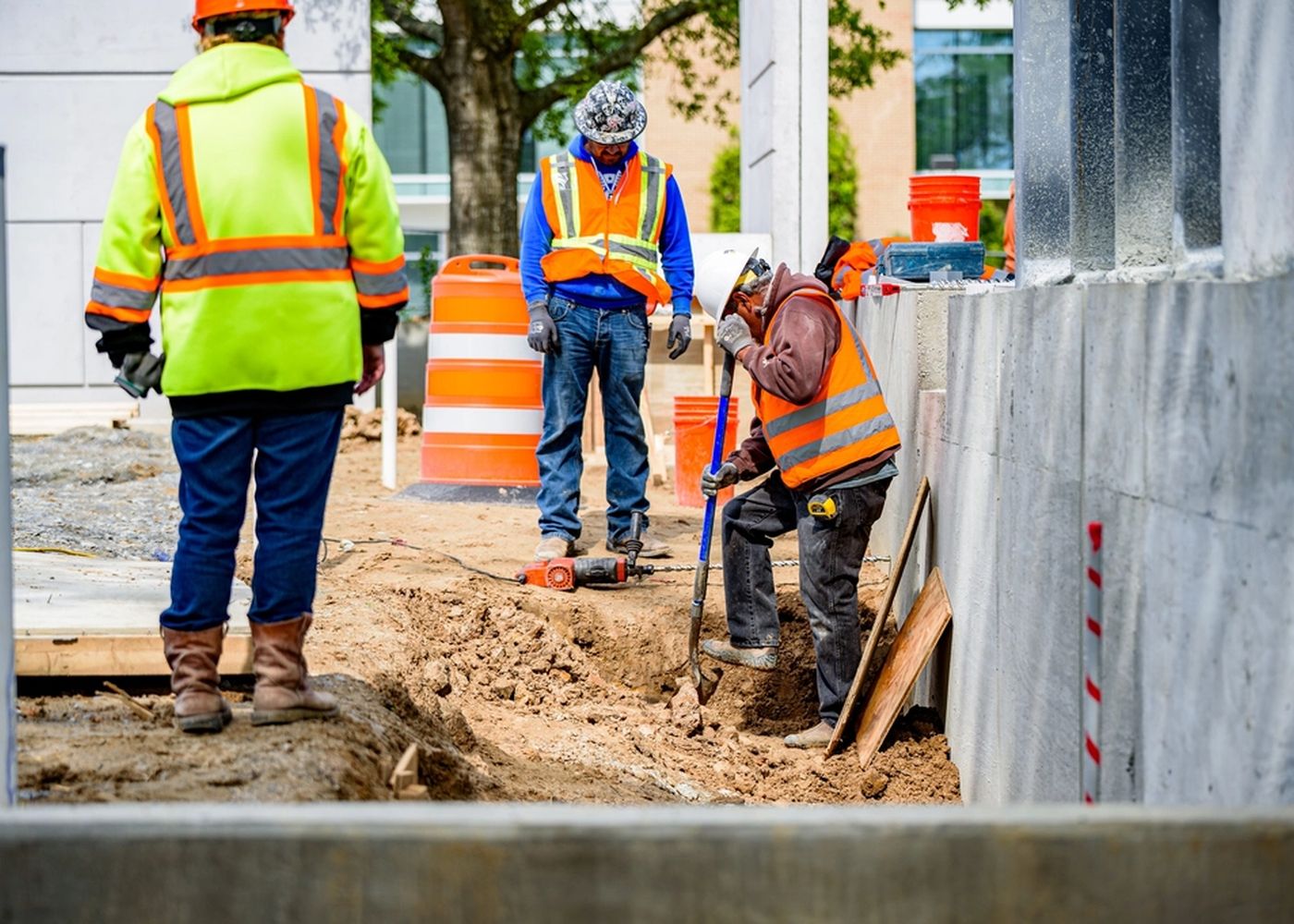 Crew finishing concrete work on a job site